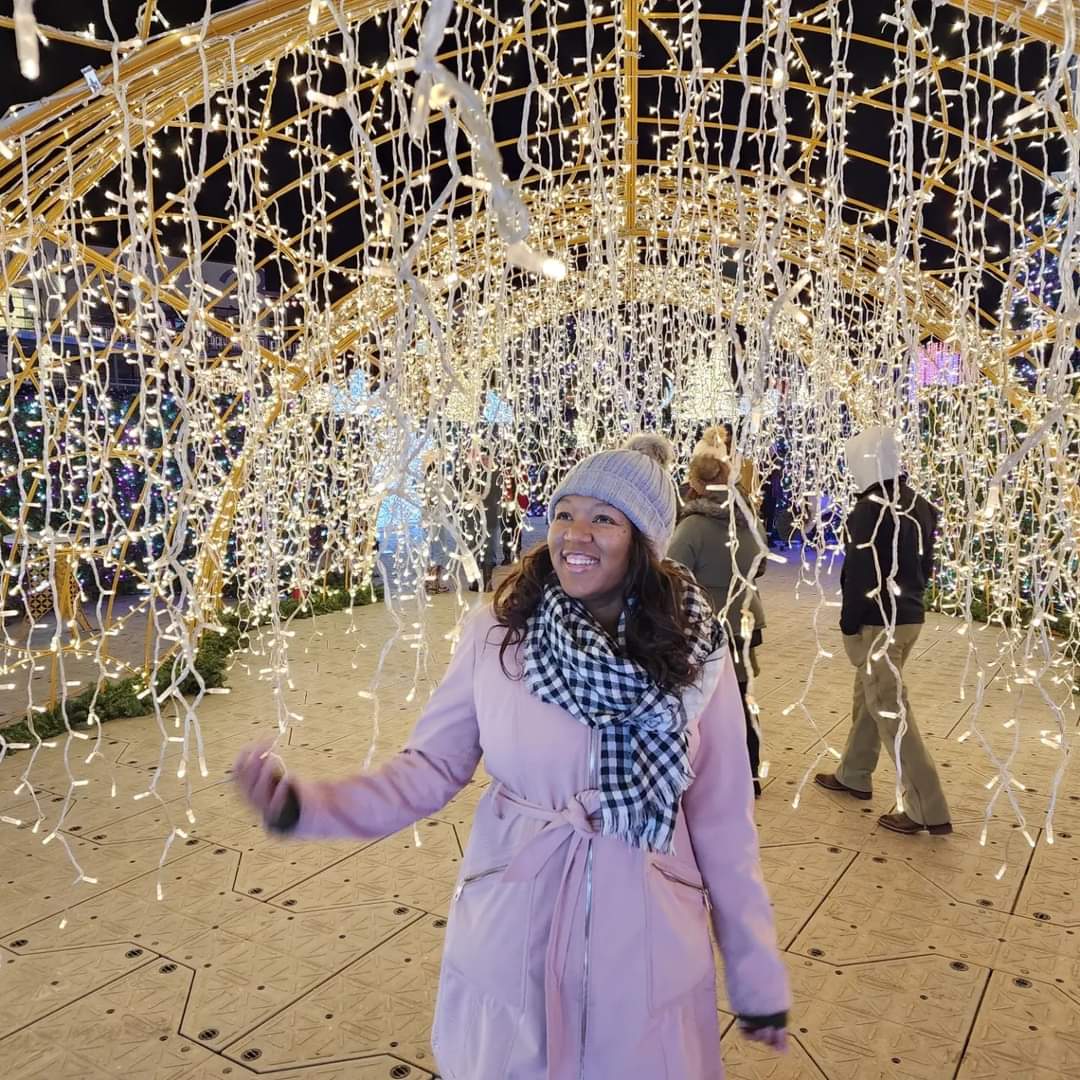 Alexis Hughes-Williams among holiday lights
